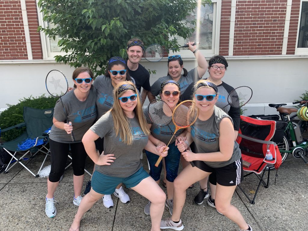 Scooter Media Employees with badminton raquets