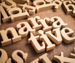 A jumble of wooden letters spelling the word narrative at the center