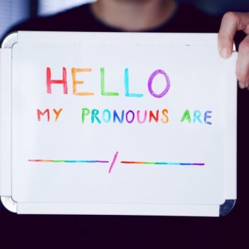 Dry-erase board with the phrase "Hello! My pronouns are:"