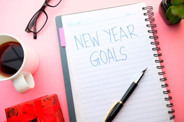 Notebook with "New Year's Goals" written in blue ink
