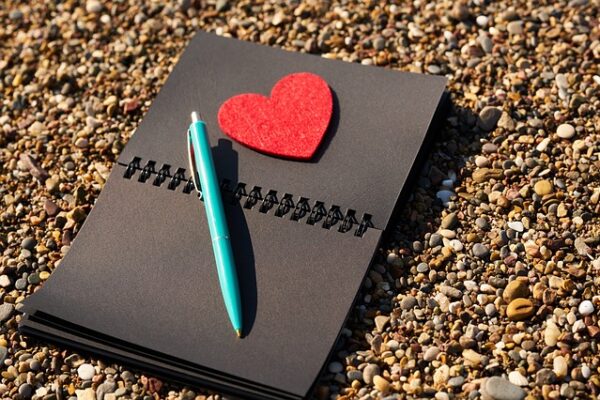 Black notebook with heart on it