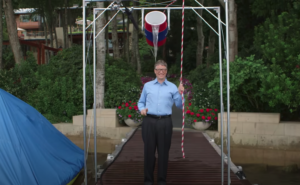 Bill Gates dumping a bucket of water on himself