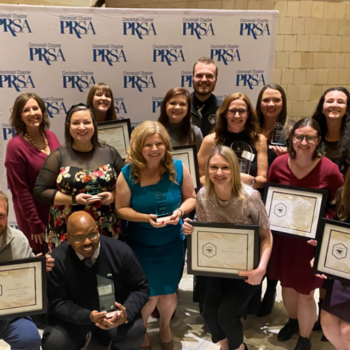 Scooter Media staff members posing with awards at the 2022 Cincinnati PRSA Blacksmith Awards