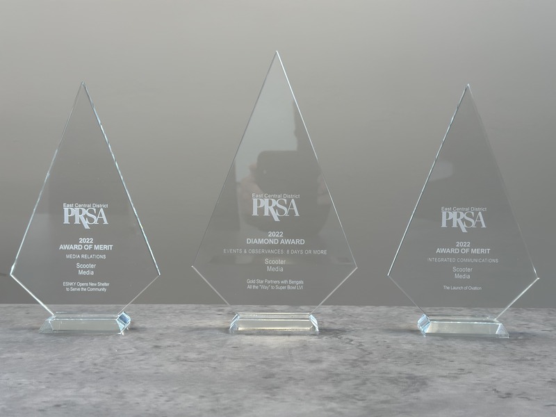 Several Diamond Awards received by Scooter Media sitting on a shelf