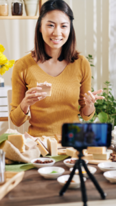 Woman Filming Herself Preparing Food Using A Phone