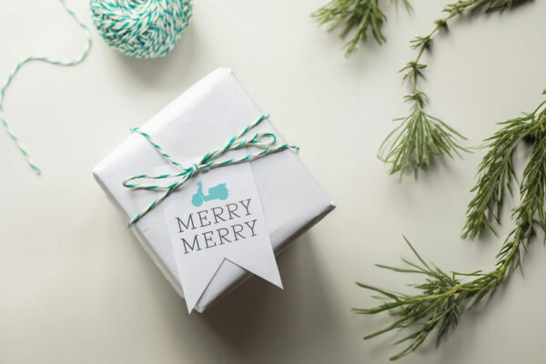 A small client gift box with the words "Merry Merry" and a Scooter logo on it.