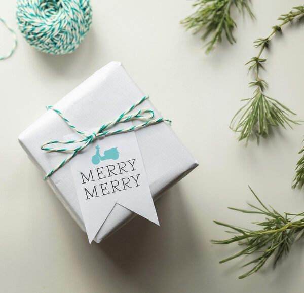 A small client gift box with the words "Merry Merry" and a Scooter logo on it.