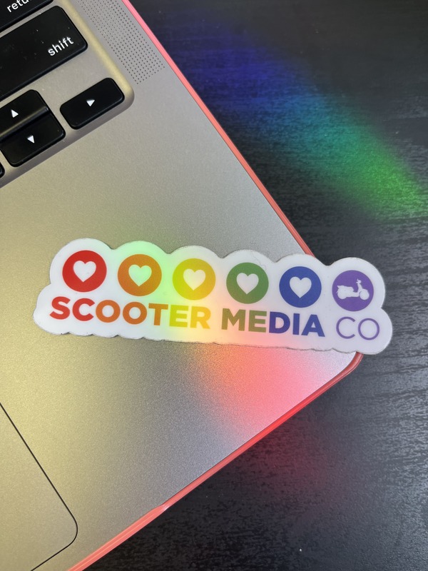 A sticker from Sticker Mule featuring the Scooter Media logo in rainbow-themed colors.
